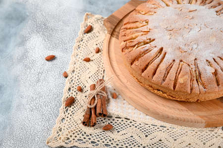 Homemade Organic Apple Pie with almond and cinnamon. Dessert Ready to Eat. Top view on light backgroundの写真素材