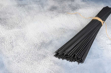 Raw black pasta on light background. High quality photoの写真素材