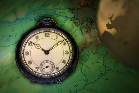 Pocket watch with golden globe on Hungary mapの写真素材
