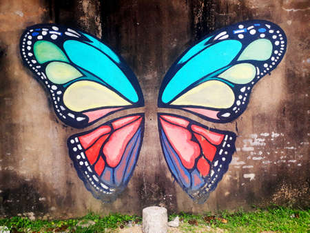 Street art with butterfly drawn on wall in Malaysiaのeditorial素材