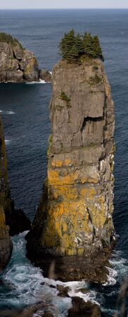 A huge sea stack on the east coast of the avalon peninsula, Newfoundland. Shot along the East Coast Trail- only accessible by foot or by boat.の写真素材