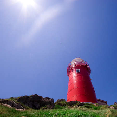 Saturated photograph of the lighthouse at Ferryland, Newfoundland, Canada.の写真素材