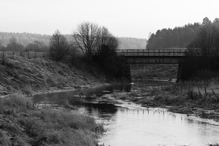 Serene Swedish river nestled in farmland outside the town of Uppsala.の写真素材