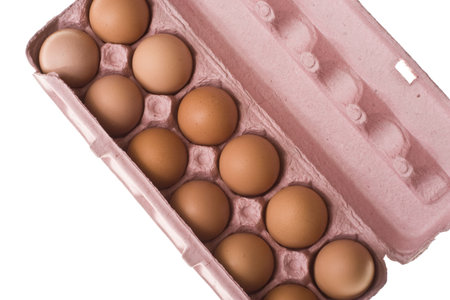 Looking down upon a carton of a dozen eggs. 