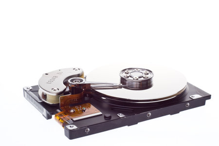 A hard disk isolated ona white background at an angle.