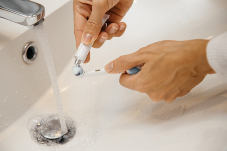 brushing teeth with toothpaste and toothbrush close-up
