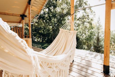 White hammock on the terrace of a private house in the forestの写真素材
