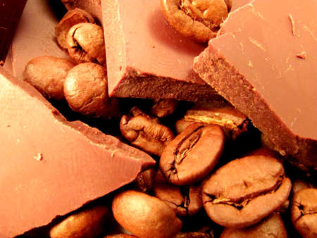 Pieces of milk chocolate with roasted coffee beans.                          の写真素材