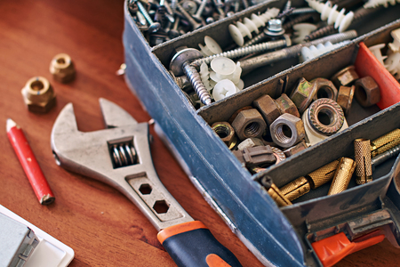 Repair kit and adjustable wrench on the tableの写真素材