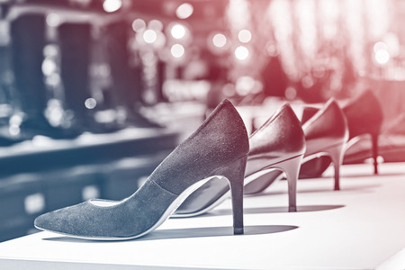 Elegant black suede woman shoes in a luxury storeの写真素材
