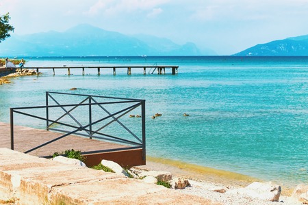 Beautiful landscape view of summer lake Garda in Italy with turquoise waterの写真素材