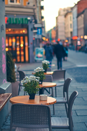Tables of outdoor street cafe in Osloの写真素材