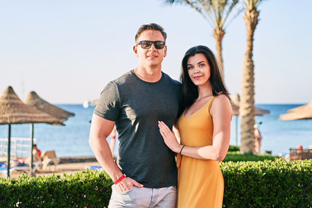 Beautiful caucasian couple on sea vacation in a tropical resortの写真素材