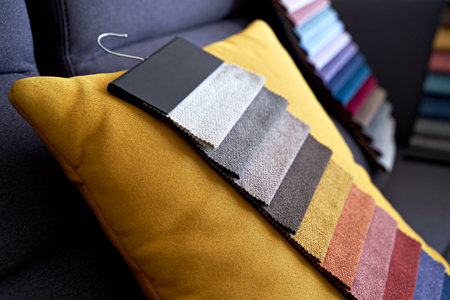 Colorful upholstery fabric samples on the sofaの写真素材