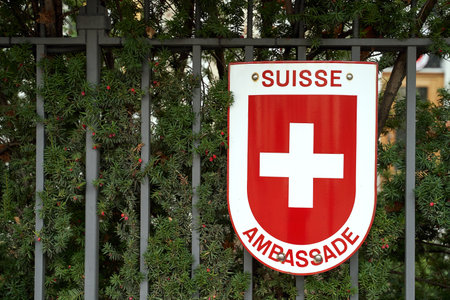 Warsaw, Poland, Nov 15, 2018: Swiss coat of arms on the Swiss Embassy fenceのeditorial素材