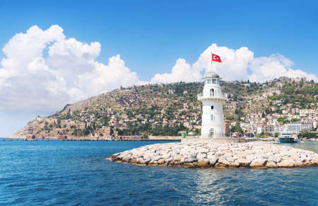 Alanya lighthouse with fortress on the background on a sunny summer dayの素材 [FY310187534695]