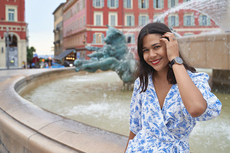 Beautiful young mixed race woman at Place Massena in Nice, Franceの写真素材