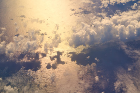 Aerial view of a dramatic beautiful ocean with clouds and their shadows
