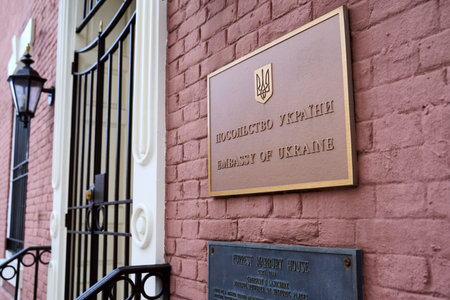 Sign and plaque of Embassy of Ukraine over the plaque of the historical Forrest-Marbury House....