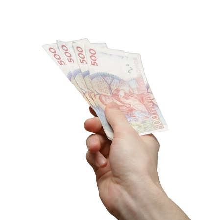 Hand offering four five hundred krona bills. Focus on handの写真素材