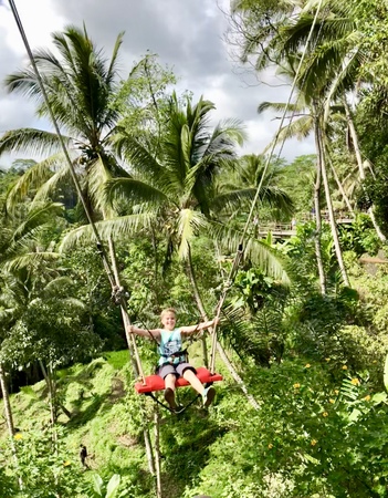 A tourist trying the Bali Swing in Ubud, Baliのeditorial素材