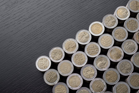 Open savings over a wooden table for financial crisis with Colombian coins