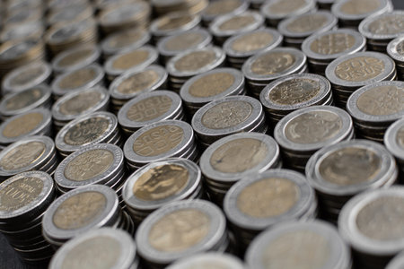 Open savings over a wooden table for financial crisis with Colombian coins