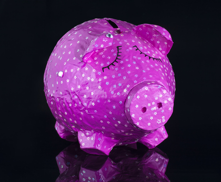Hand made Piggy bank on black backgroundの写真素材