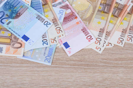 Euros on woodの写真素材