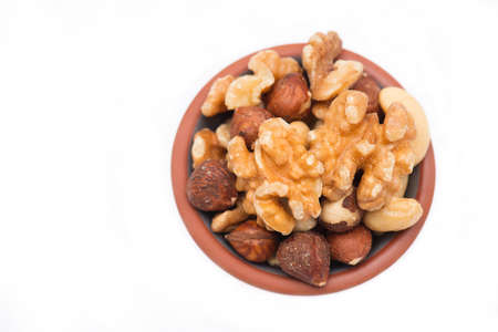 A mix of nuts isolated on a white backgroundの写真素材