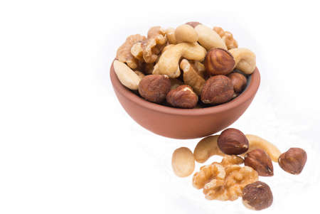 A mix of nuts isolated on a white backgroundの写真素材