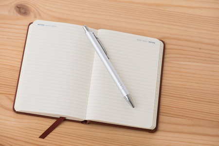 Empty calendar with a pen lying on a table