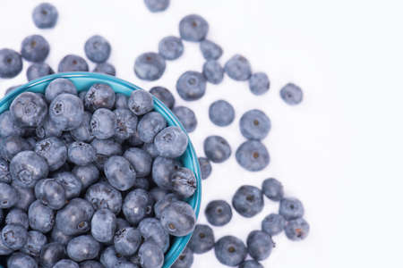 Fresh blueberries in a bowl isolated on a white backgroundの写真素材