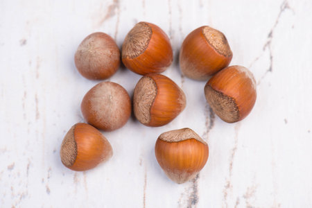 Hazelnuts on a structured background