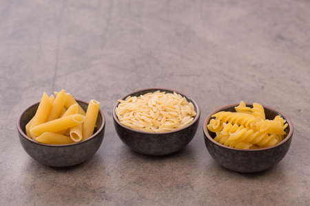 Different types of pasta, empty copy space for textの写真素材