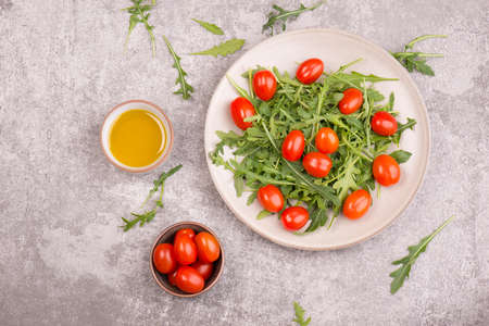 Arugula salad and cherry tomatoesの写真素材