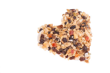 Muesli with otas, nuts and fruits isolated on a white backgroundの写真素材