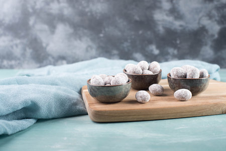 Spiced almonds with chocolate powder, traditional german christmas sweets with spices like cinnamon,...