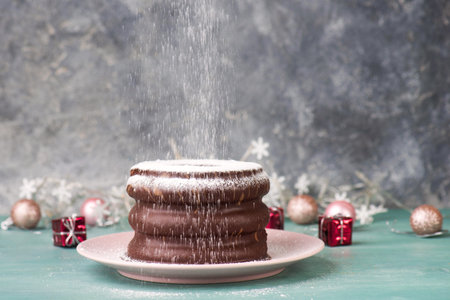 Traditional german christmas chocolate cake called Baumkuchen, winter season sweets