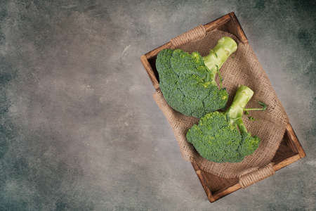 Fresh broccoli on a textured background, empty space for textの写真素材