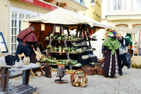 Traditional medieval Easter market in Echternach in Luxembourg, costs from middle age, pottery, herbs and more for saleのeditorial素材