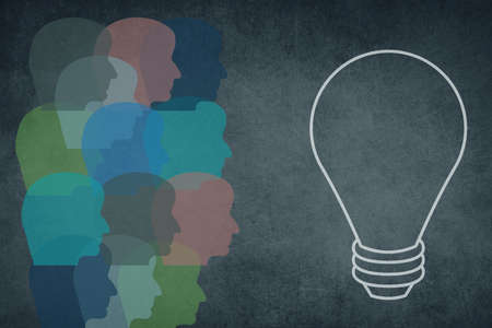Silhouette of a face with a lightbulb, textured background, empty copy space for textの写真素材