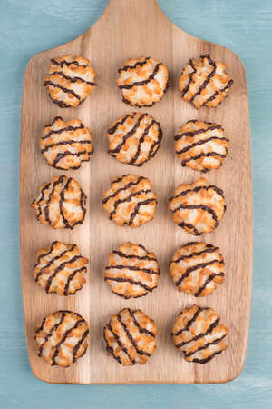 Coconut macaroons on a textured blue backgroundの写真素材