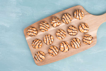 Coconut macaroons on a textured blue backgroundの写真素材