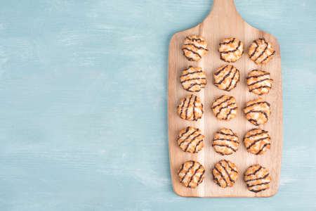 Coconut macaroons on a textured blue backgroundの写真素材