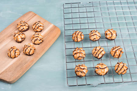 Coconut macaroons on a textured blue backgroundの写真素材