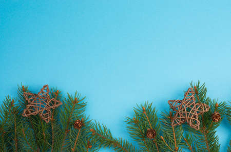 Christmas background with branches of fir, empty copy space, blue backdropの写真素材