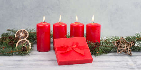 Red candles on a advent wreath, christmas decoration with candlelightの写真素材