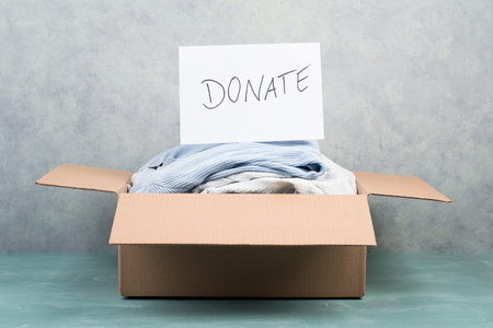 Package with used clothes for donation, second hand use for poor people, welfare