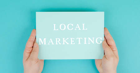 Local marketing, support small businesses, enviromental shopping, text on paper, blue backgroundの写真素材